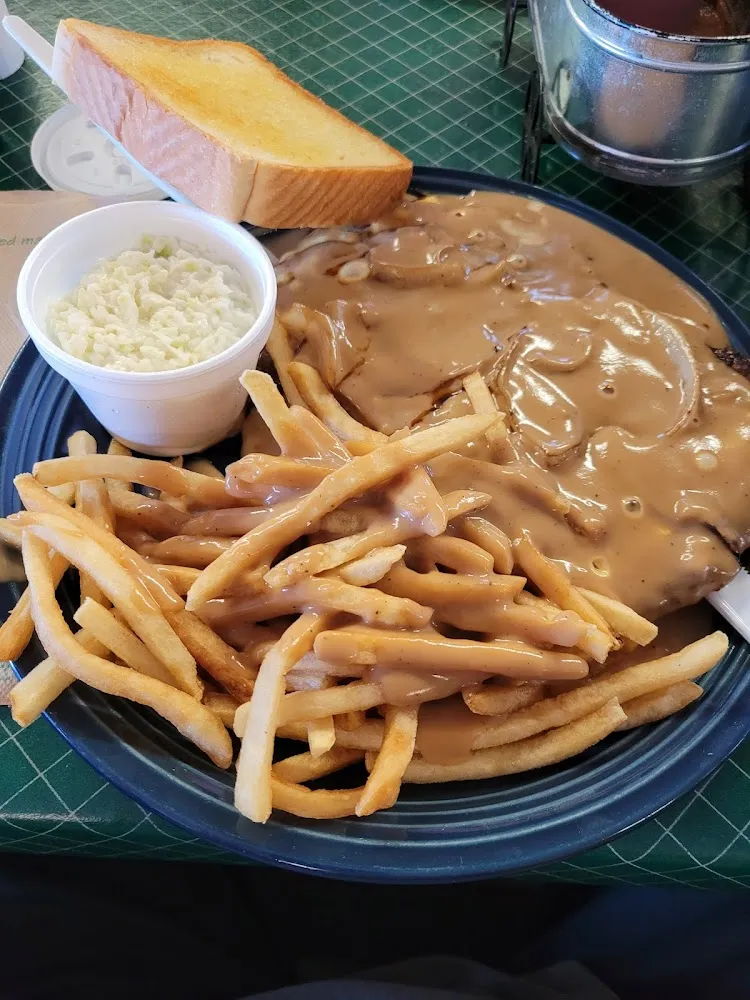 Hamburger Steak with Cheese Onions and Gravy Even on the Fries